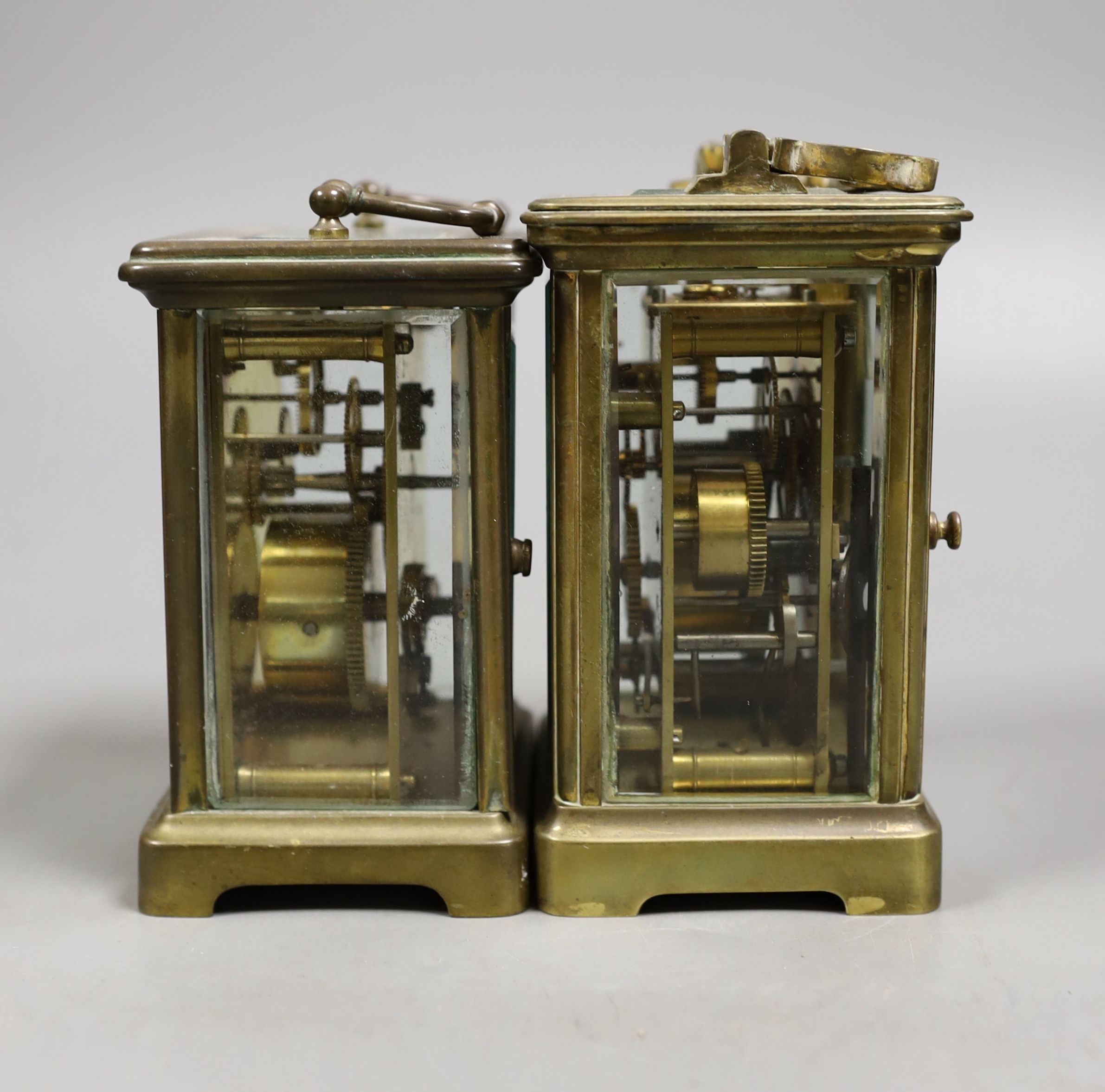A French brass carriage timepiece with alarm and a French brass carriage timepiece, Tallest 11.5 cms high.